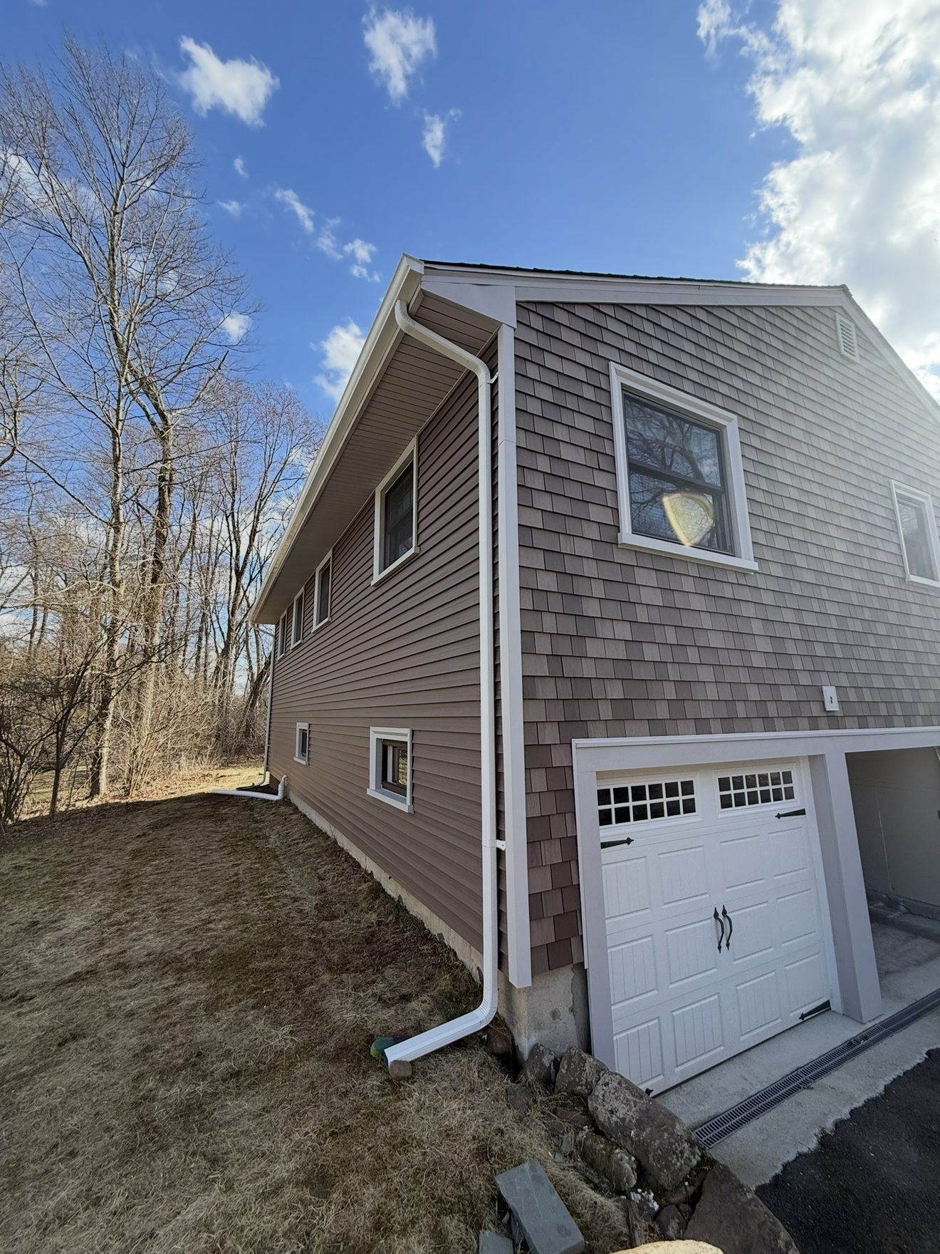 Finished siding installation and garage addition on a Connecticut home